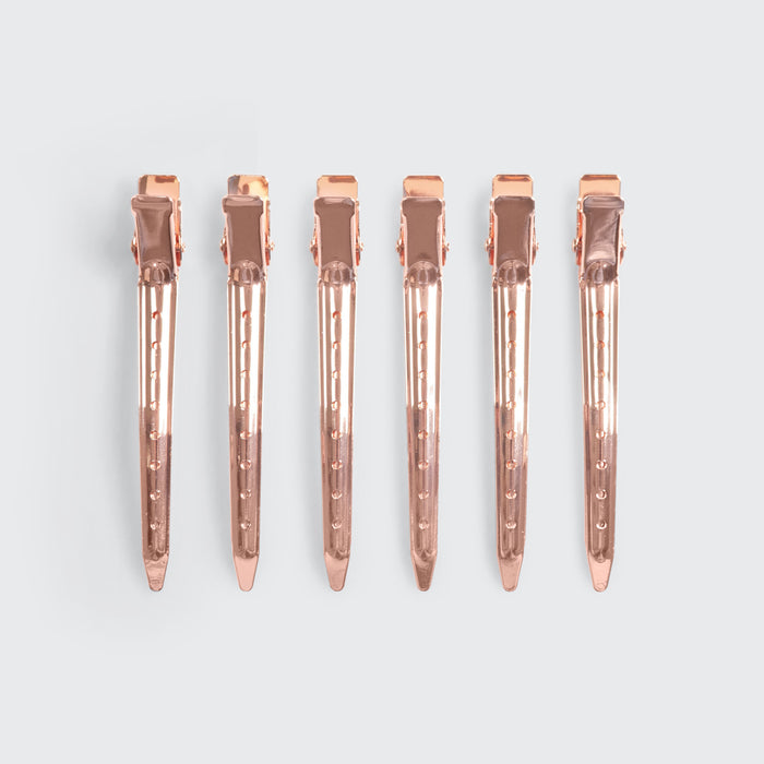 Kitsch Hair Rollers and Styling Clips Bundle styled with hair-care props on a warm background