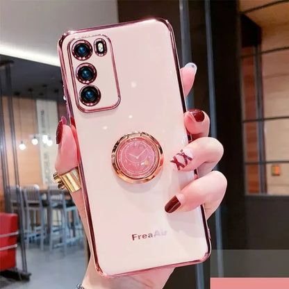 a woman holding a phone with a ring on it