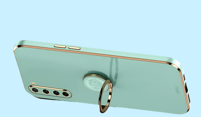 Mint green smartphone with a gold-colored ring holder attached to its back.