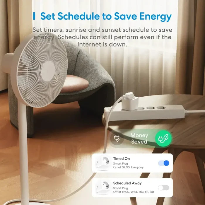 A woman sitting on a couch with a fan